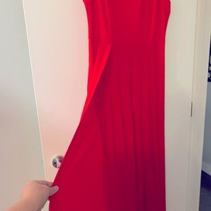 Sleeveless pant suit with long black cape attached